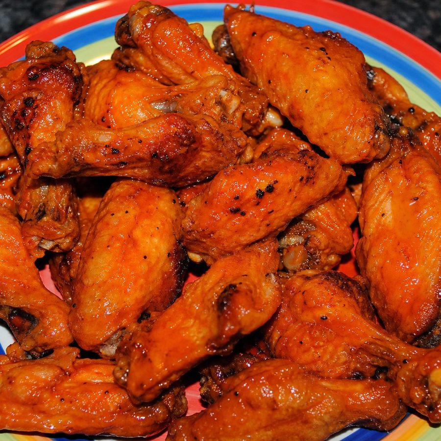 A plate of glazed hot wings